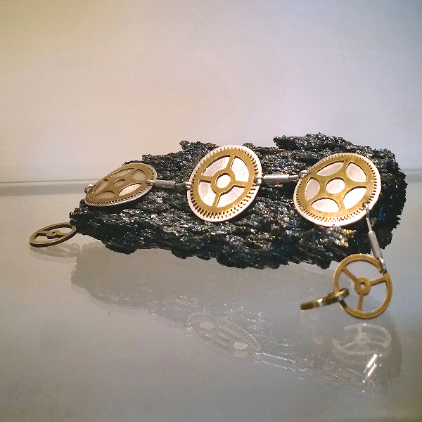17002B – Brass gears on Silver – bugle bracelet